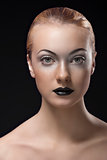 blonde girl with dark lipstick in front of the camera