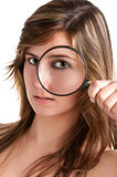 Woman looking trough a loupe