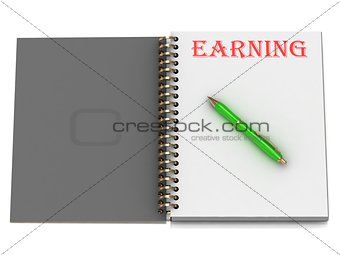 EARNING inscription on notebook page 