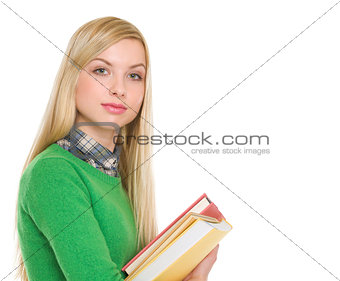 Portrait of student girl with books
