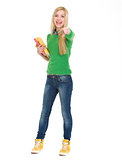 Full length portrait of happy student girl pointing in camera