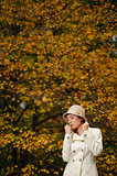 attractive woman in evening autumn park