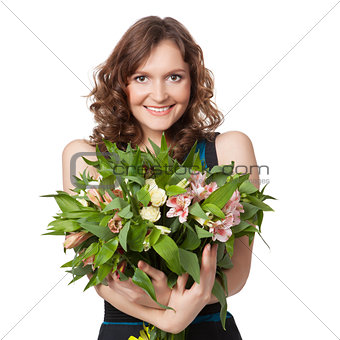 Portrait of pretty brunette holding bouquet of flowers