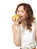 Portrait of fit young girl biting a fresh ripe apple 