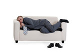 businessman sleeping on a sofa