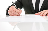 Front view of a business man signing a contract