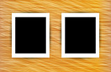 Two photo frames on abstract wooden background