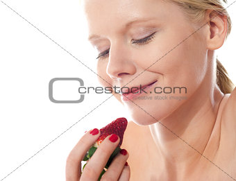 Young lady holding a strawberry