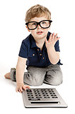 Cute boy counting with calculator.