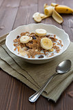 Breakfast cereals with milk and banana