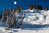 Full Moon above Riding Chairlift in French Alps Mountains, Megev