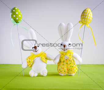 Easter funny bunnies with eggs