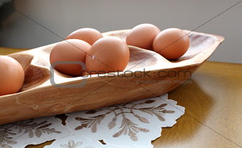 Wood platter with farm fresh brown eggs