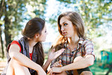 two girlfriends outdoor talking