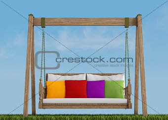Wooden swing on grass