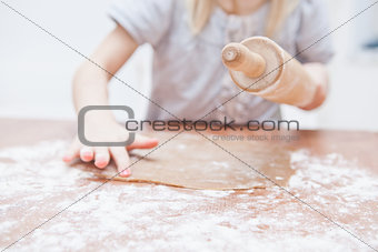 Young girl making gingerbread