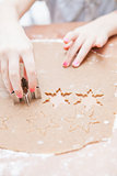 Cutting gingerbread shapes from dough