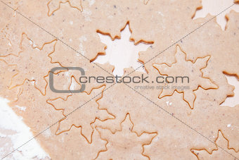 Gingerbread dough with star shapes