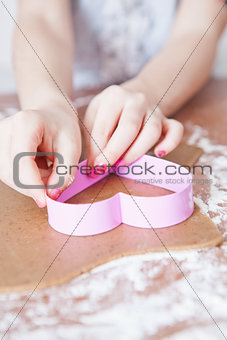Young girl making gingerbread