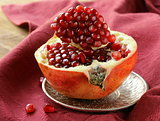 pomegranate ripe fruit  on a silver plate