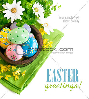 Easter eggs in the pot with flowers