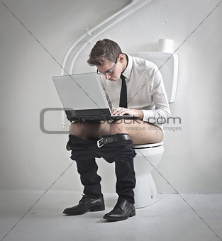 Young Businessman on the Toilet