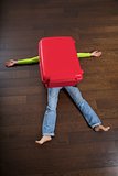 traveler crushed by red suitcase