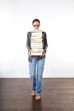 woman with a pile of books 