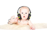 Portrait of 6 month old boy with headphones