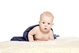 Adorable happy baby in colorful towel on white background