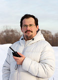 Man with cb radio outdoors winter day