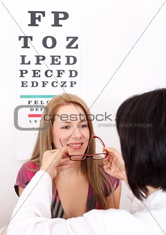 Woman buying glasses