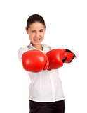 Portrait of business woman wearing boxing gloves