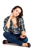 Teenage girl sitting and listen music
