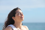 Beautiful girl breathing on the beach