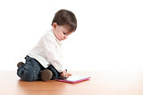 Baby playing with a digital tablet 