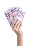 Woman hand holding five hundred euro banknotes