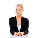 Beautiful smiling business woman sitting at the desk