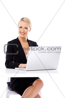 Smiling business woman using laptop computer
