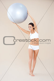 Woman doing exercises with fitness ball