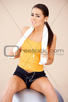 Woman sitting on fitness ball