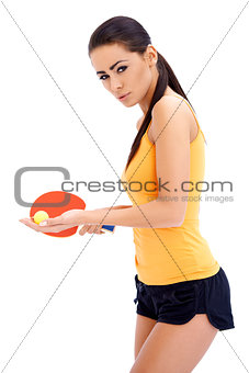 Female table tennis player ready to serve