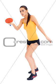 Female tabne tennis player ready to serve