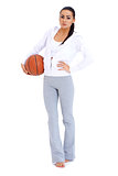 Woman standing and holding basketball