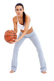 Woman standing and holding basketball