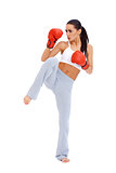Full body shot of female kick boxer