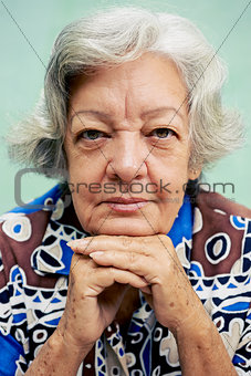 happy old woman smiling and looking at camera