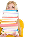 Student girl holding stack of books