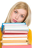 Frustrated student girl holding stack of books