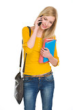 Happy student girl talking cell phone